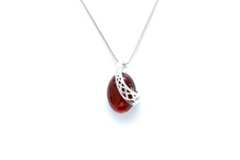 Load image into Gallery viewer, Cherry Red Celtic Amber Pendant - foxberryparkproducts