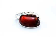 Load image into Gallery viewer, Cherry Red Celtic Amber Pendant - foxberryparkproducts