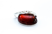 Load image into Gallery viewer, Cherry Red Celtic Amber Pendant - foxberryparkproducts
